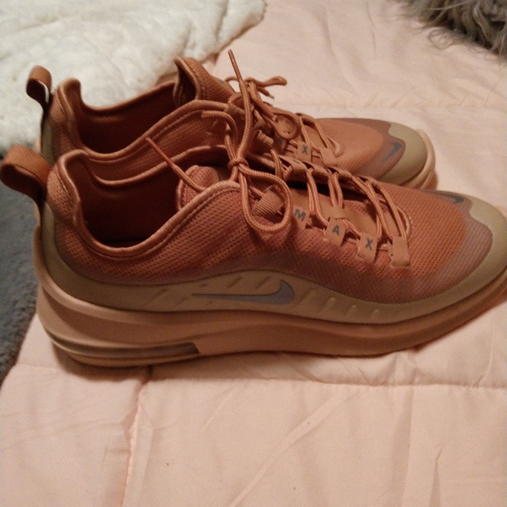 Nike tennis shoes rose gold color